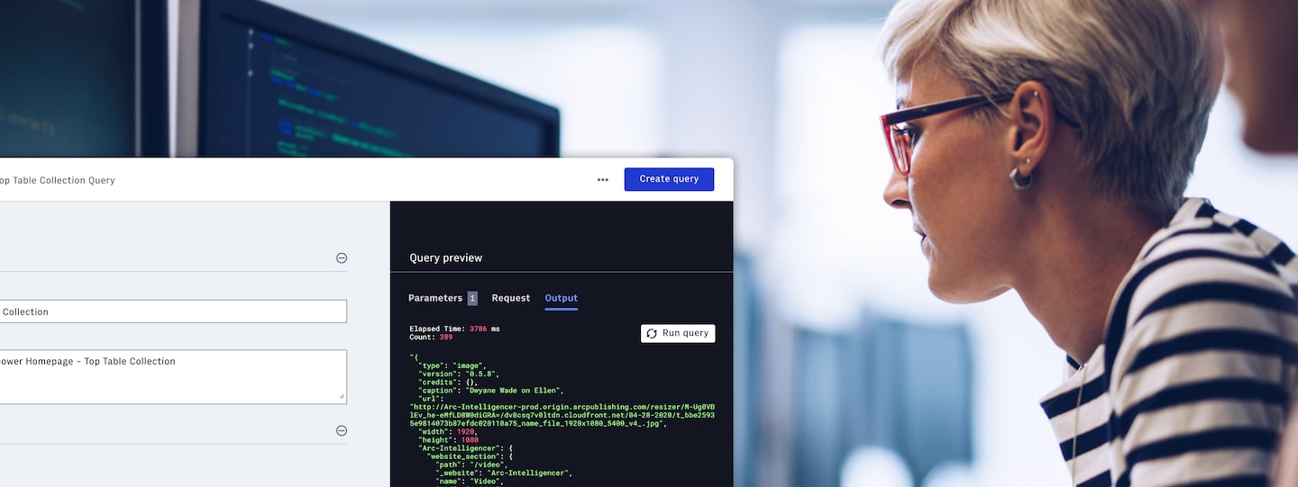 woman looking at code on a screen